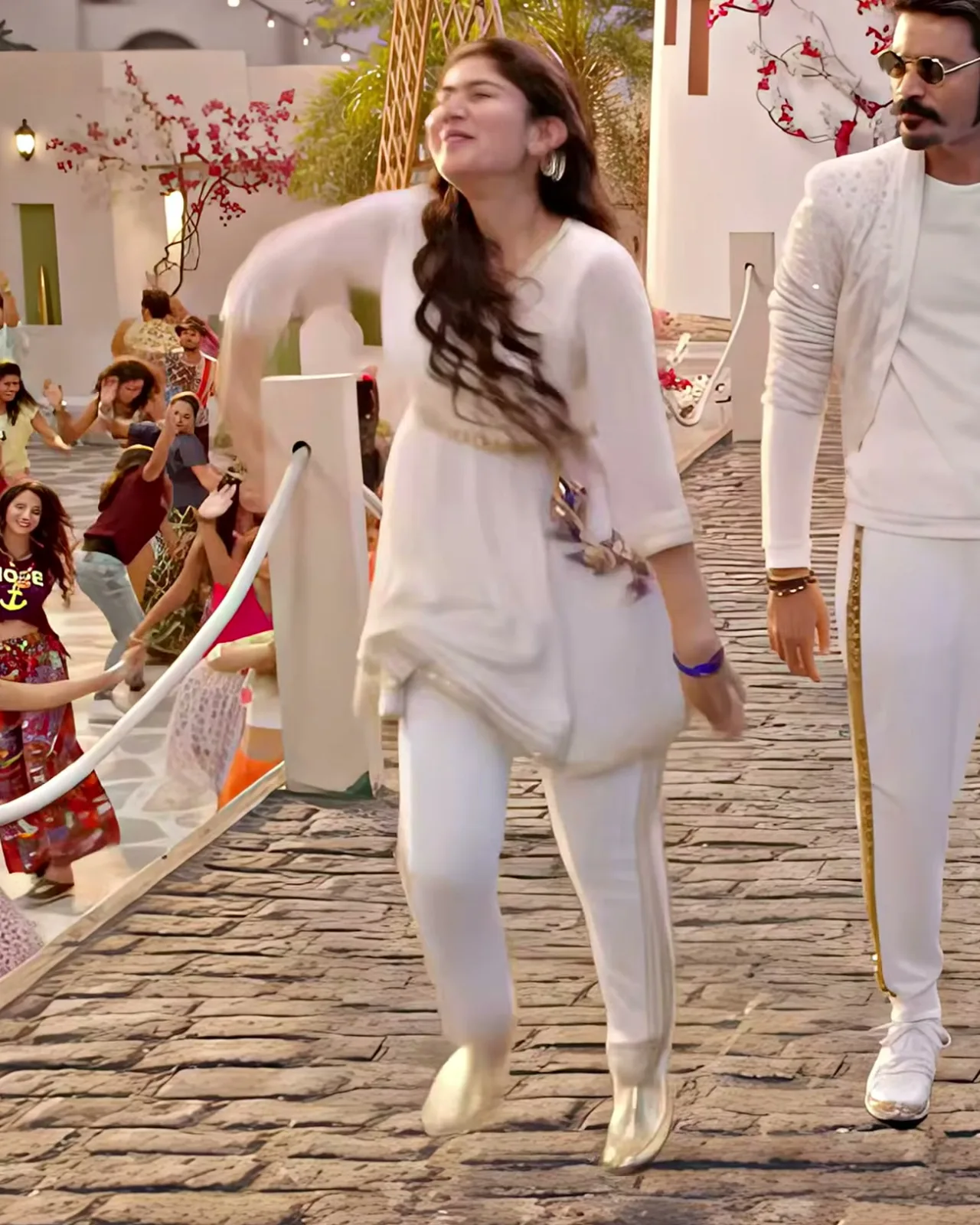 Sai Pallavi — Full length — the gold stripe down the churidar, the lilac bangles, the gold flats