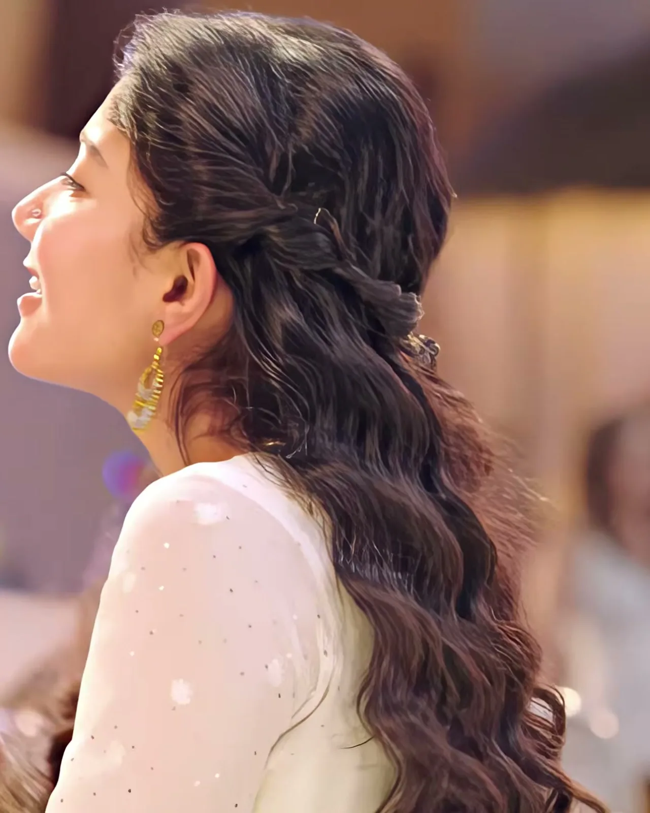 Sai Pallavi — From the side — the sheer sleeve, its scattered white thread flowers, the twisted half-up hair