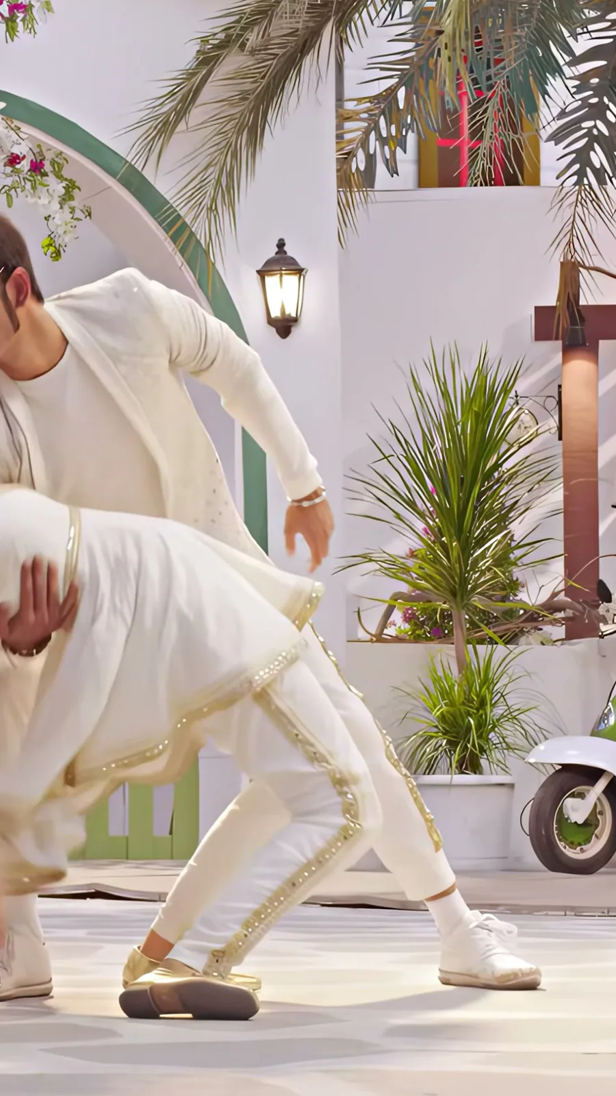 Sai Pallavi — The gold flats, clearly: closed toe, low heel, no strap