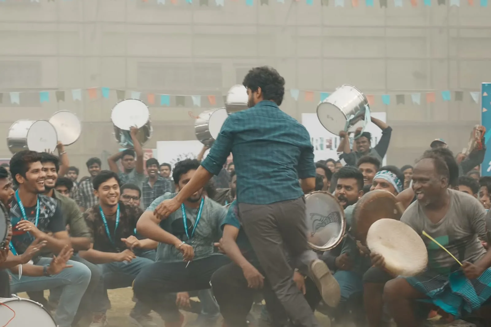 Vijay — Wide — the one teal shirt in a crowd wearing the same colour