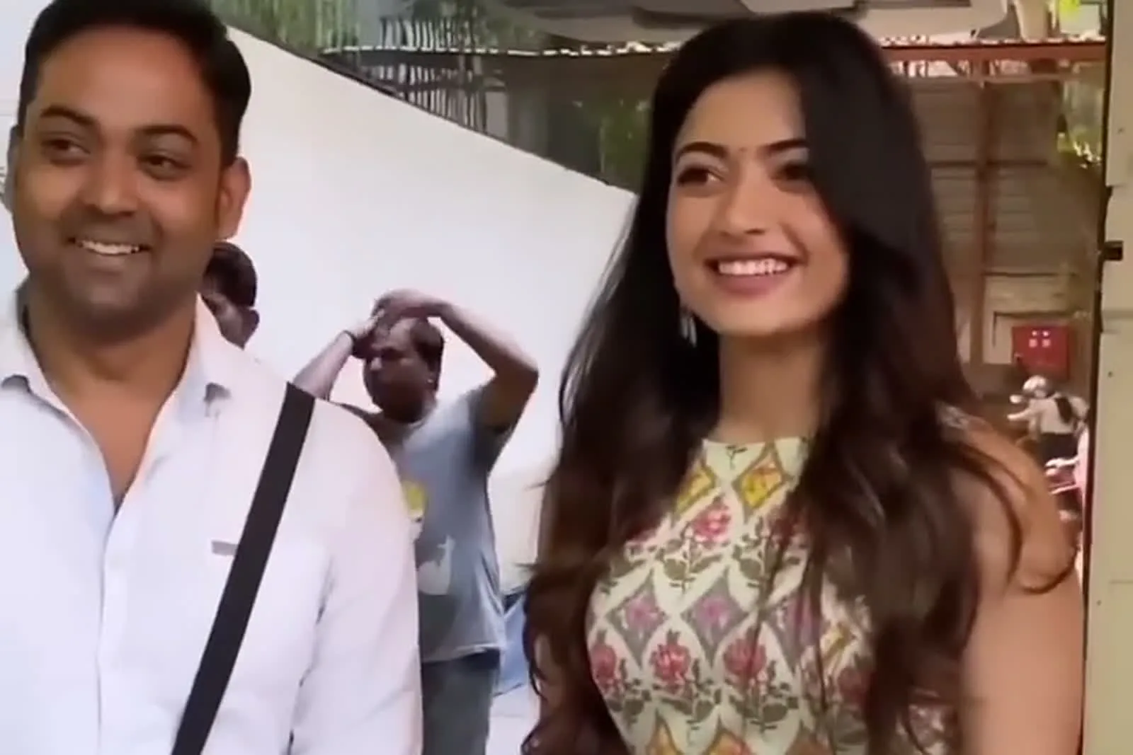 Rashmika Mandanna — The pink tassel ties at the left side seam, just visible at the hip