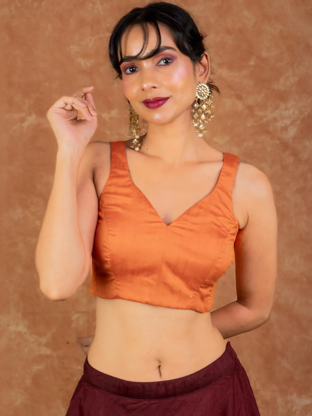 FIGURES DESIGNER Sleeveless deep-V solid orange blouse