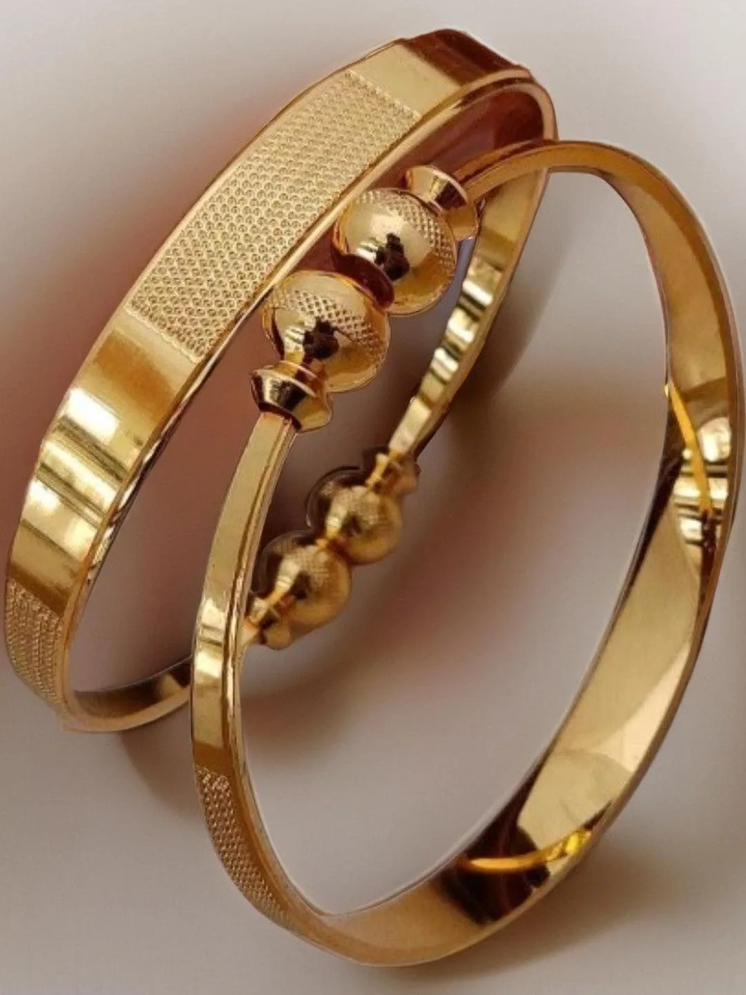 Jewels Kafe Slim gold-toned bangles, set of two