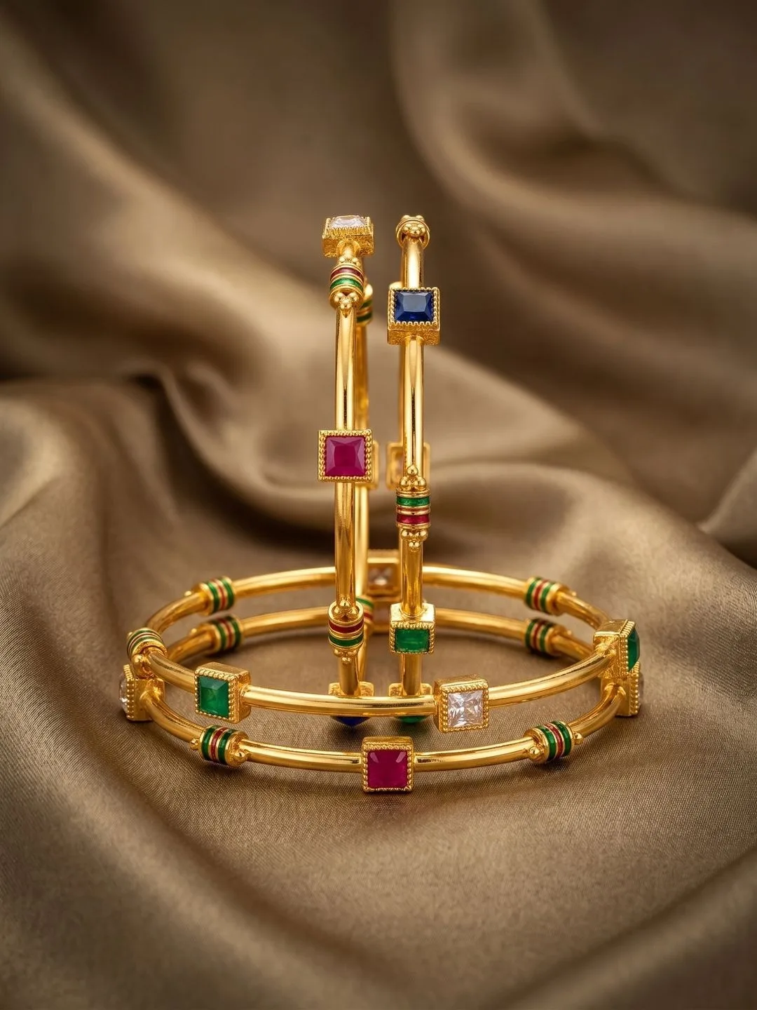 Nui Our pick for the colour in it — four enamelled gold-plated bangles