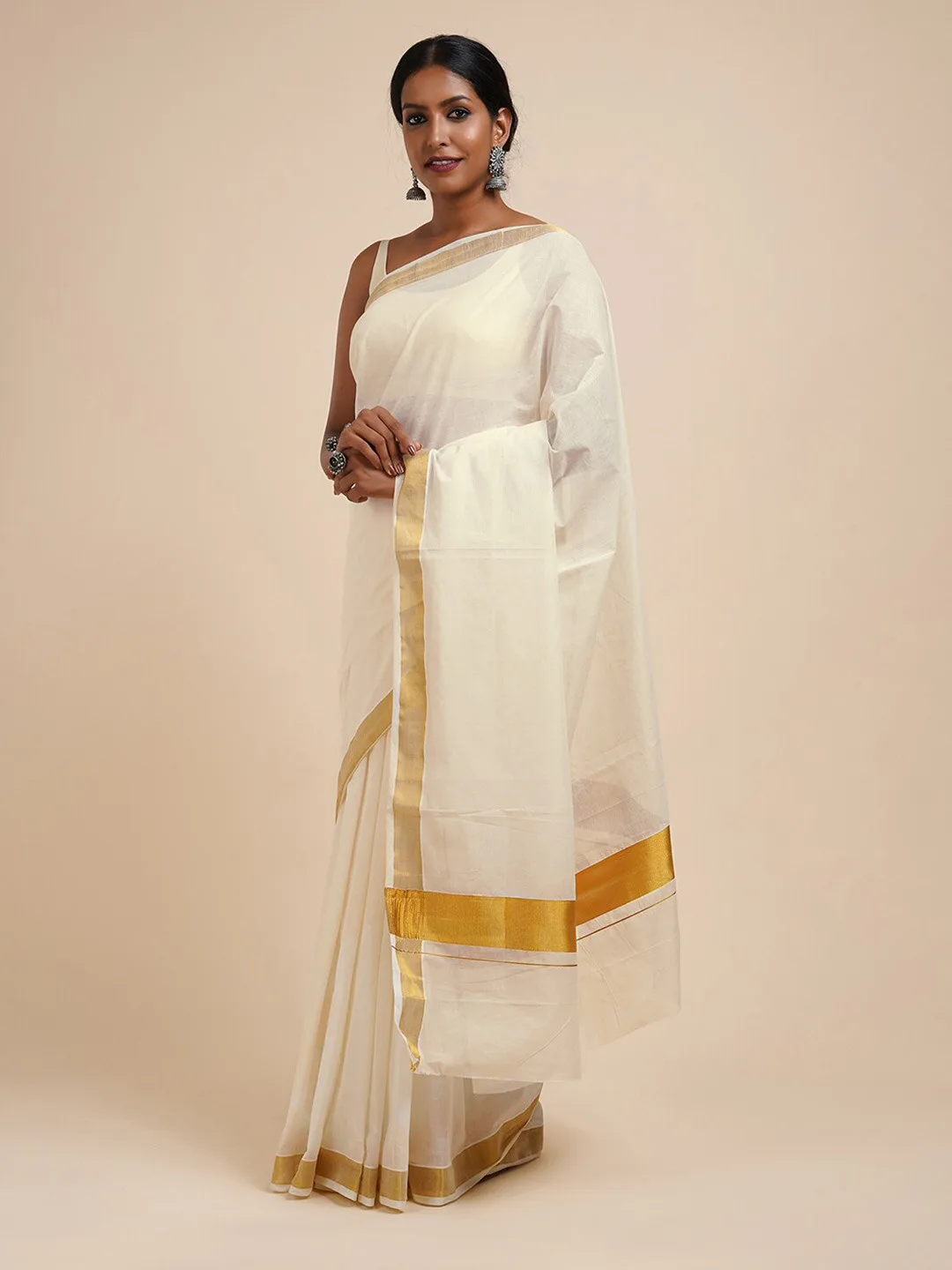 TEEJH Our pick under ₹800 — white kasavu saree with a thin gold zari border