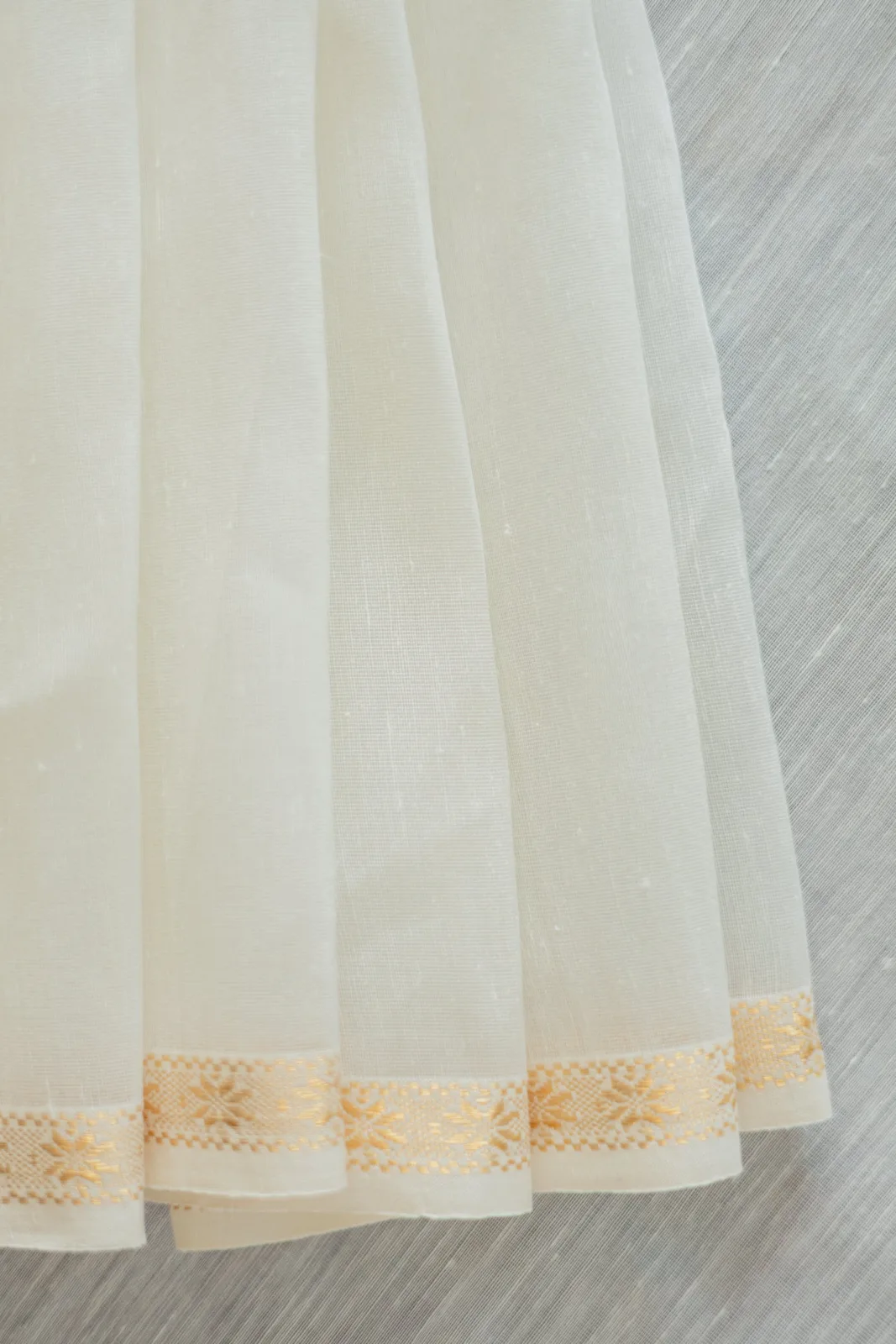 Neela by Anu Vardhan White silk-linen saree with a small gold zari border