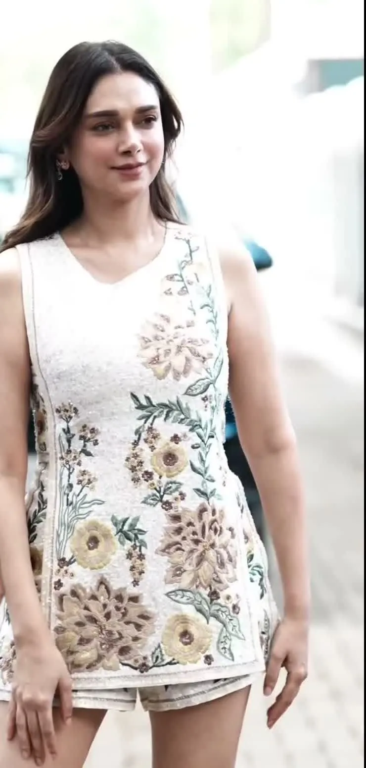 Aditi Rao Hydari — Full length — the matching shorts, and how loosely the boxy tabard is worn