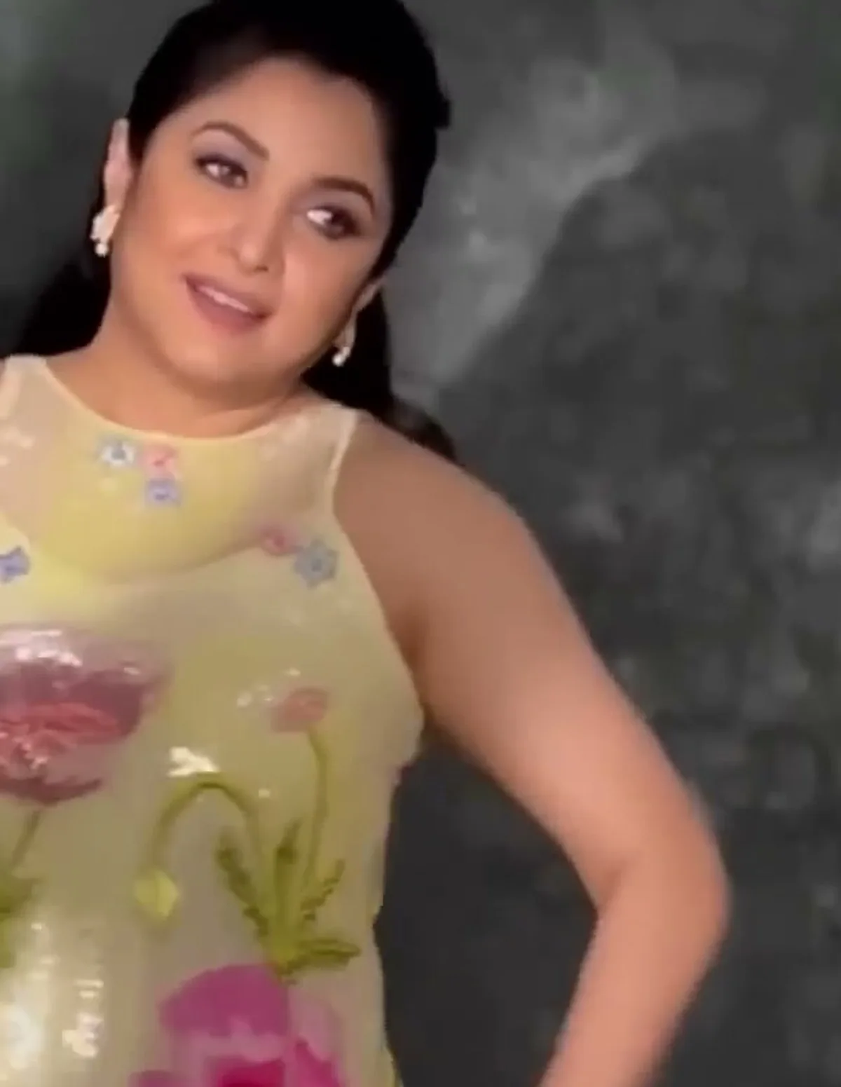 Ramya Krishnan — Fuchsia poppy and fern-green stems at the waist