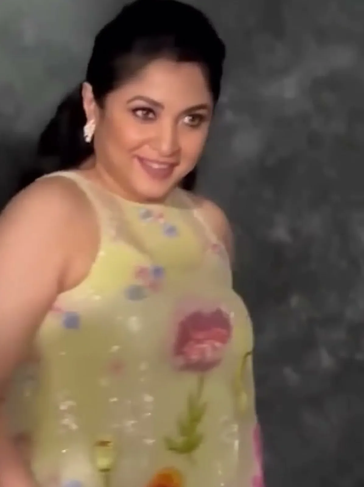 Ramya Krishnan — The cut-in armholes and the lemon slip under the sheer yoke