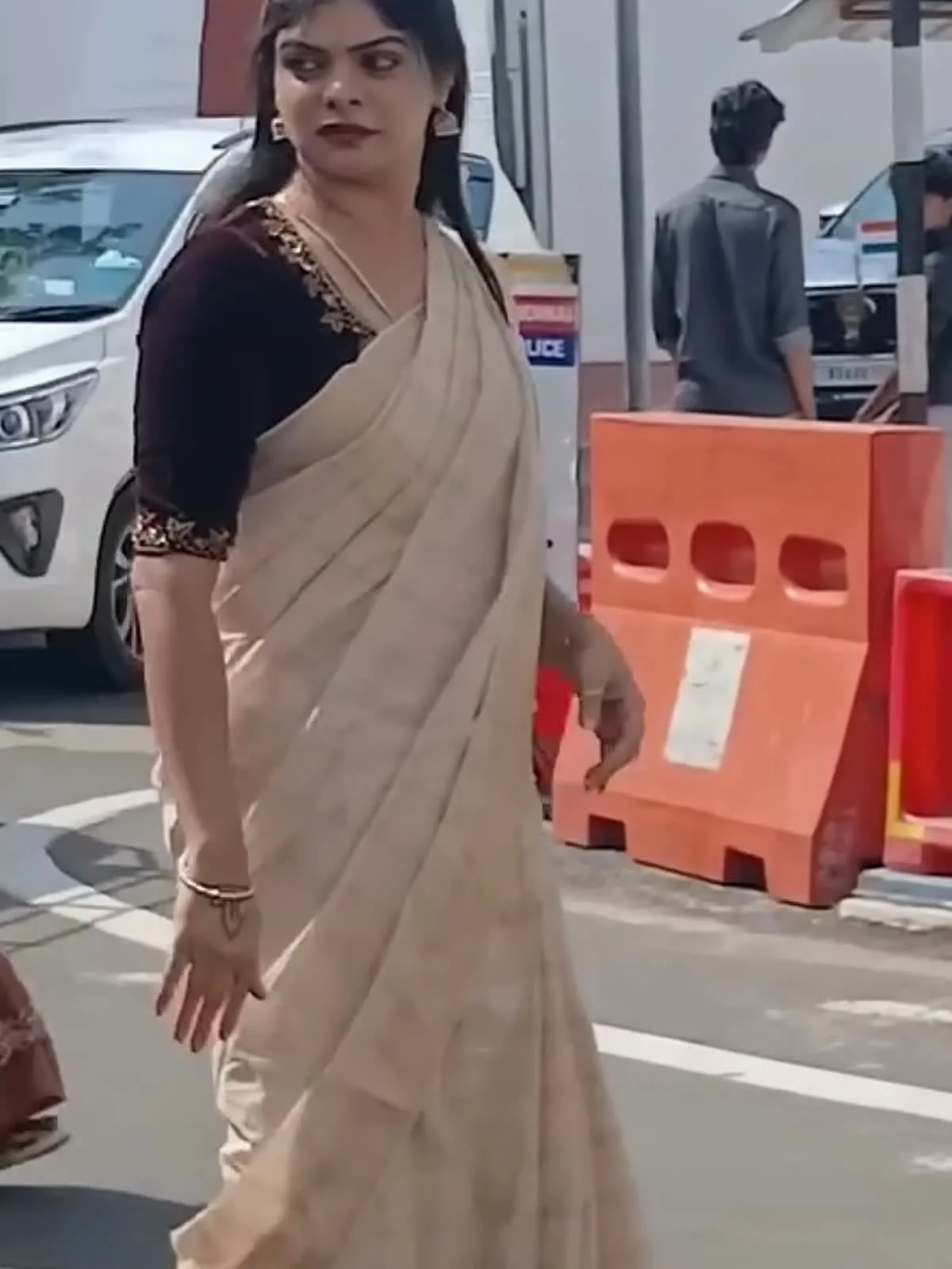 Kanimozhi Santhosh — Close on the blouse — the gold zari band at the neckline and again at the sleeve hem