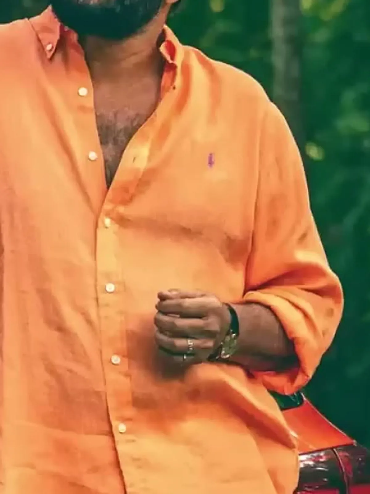 Mammootty — Close on the placket: pearl buttons, no chest pocket, the pony where a pocket would sit