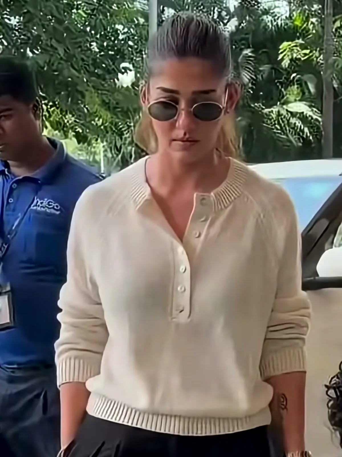 Nayanthara — Walking in: the body of the knit is relaxed and stops at the high hip, and nothing is tucked