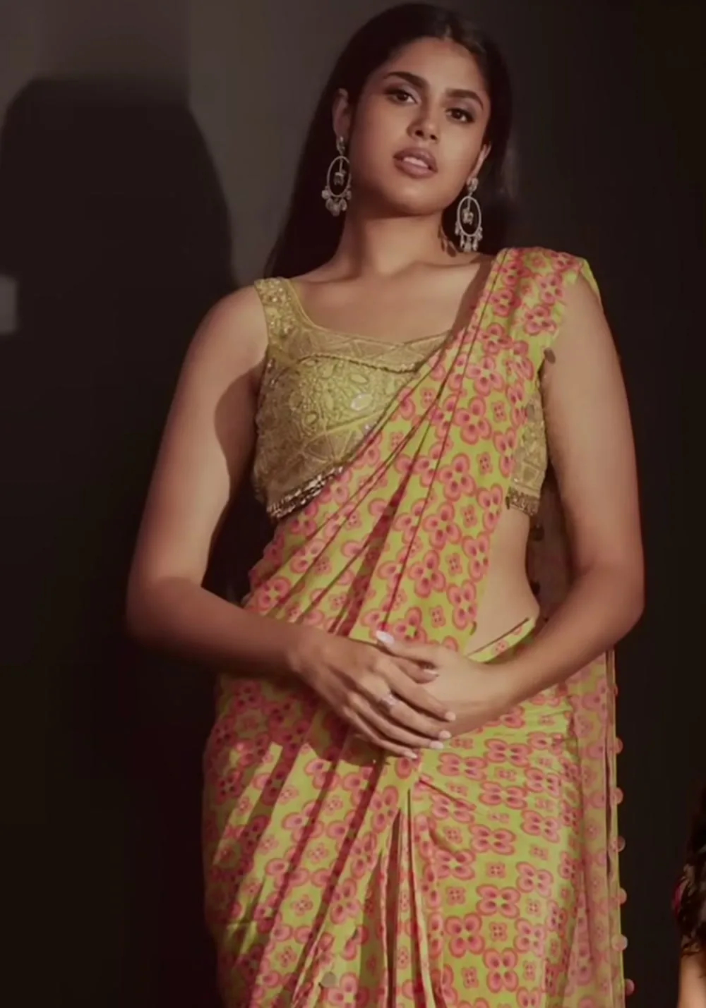 Faria Abdullah — The pallu over the shoulder: the gold mirror discs down its edge and the sequinned hem of the blouse