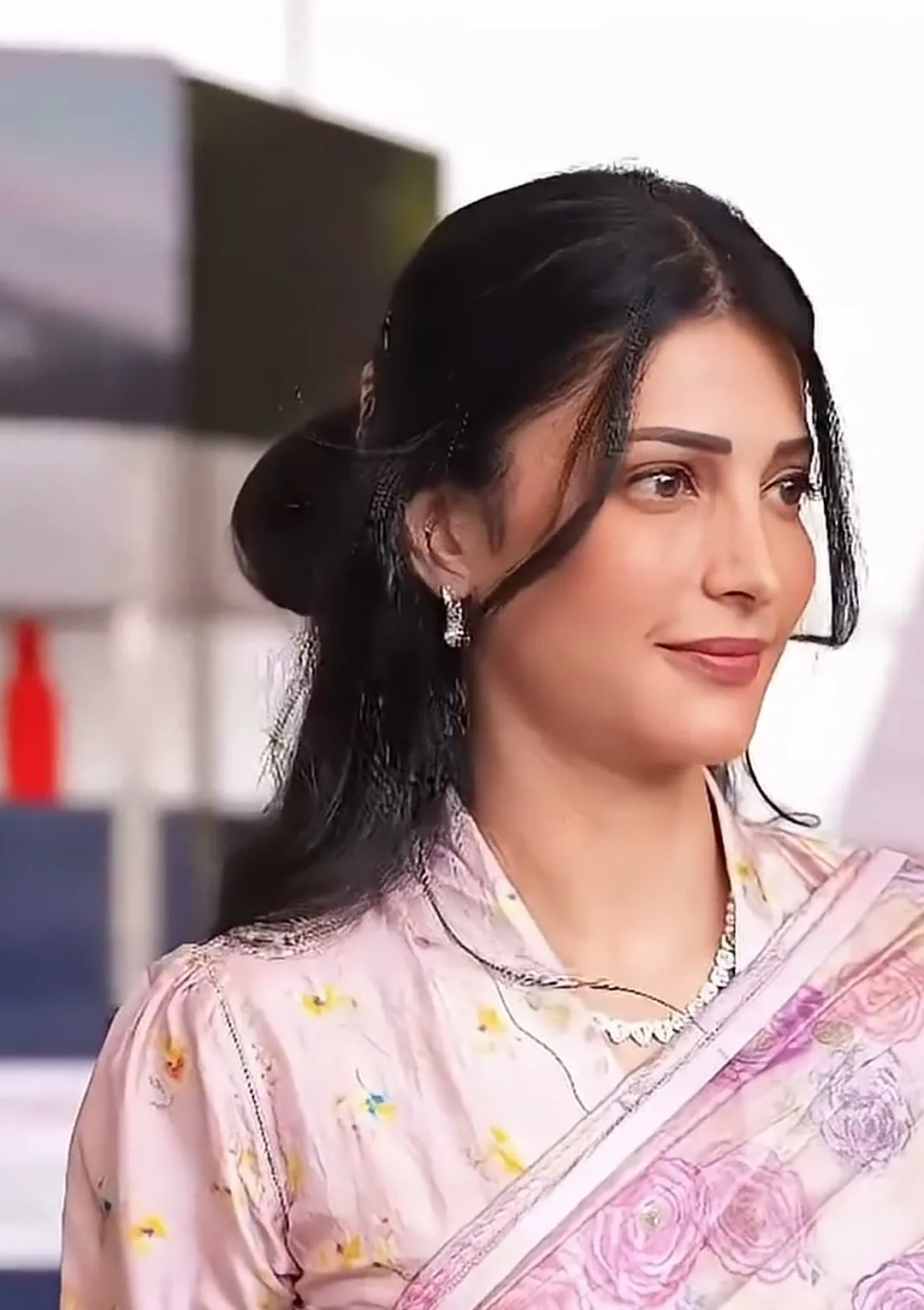 Shruti Haasan — Short puffed sleeve, crystal necklace, hair half-up