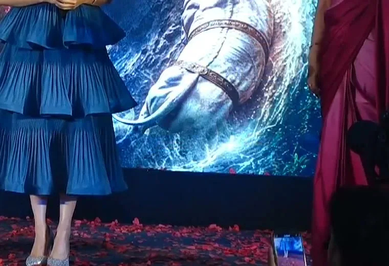 Tamannaah Bhatia — The hem and the shoes: three tiers stacked, and clear vinyl pumps with a crystal-encrusted toe