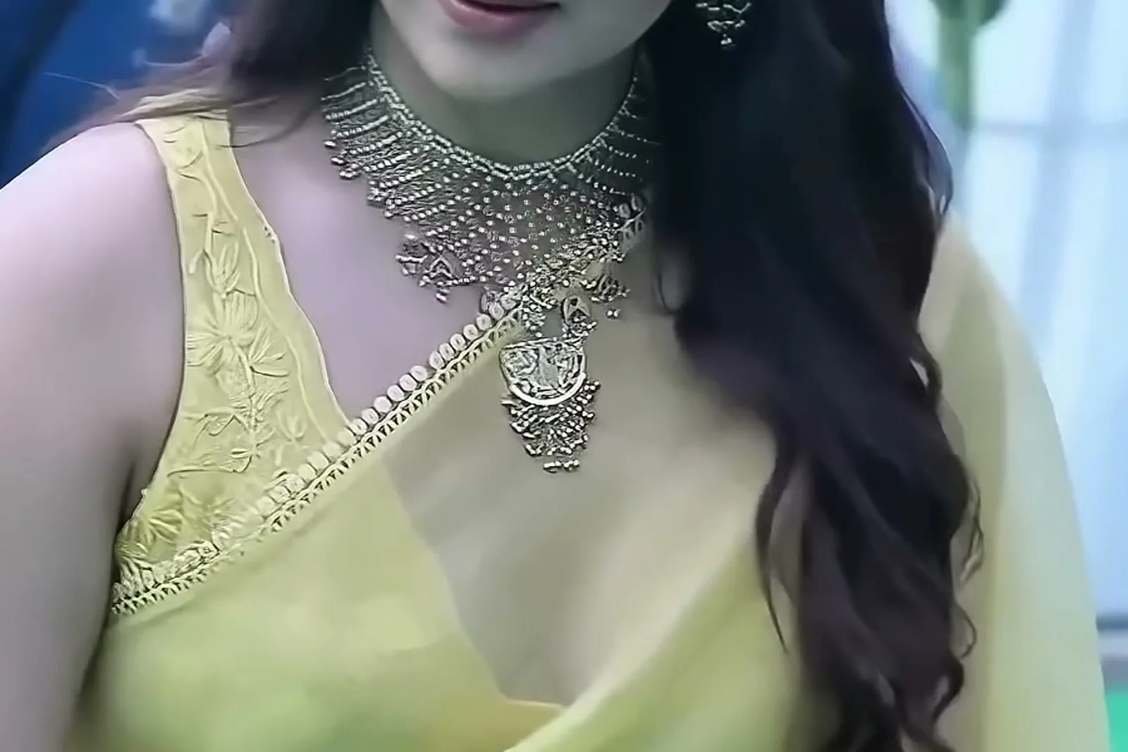 Keerthy Suresh — Close on the neckline: the jaali lattice, its fringed lower edge, and the V of the blouse with its beaded gold trim
