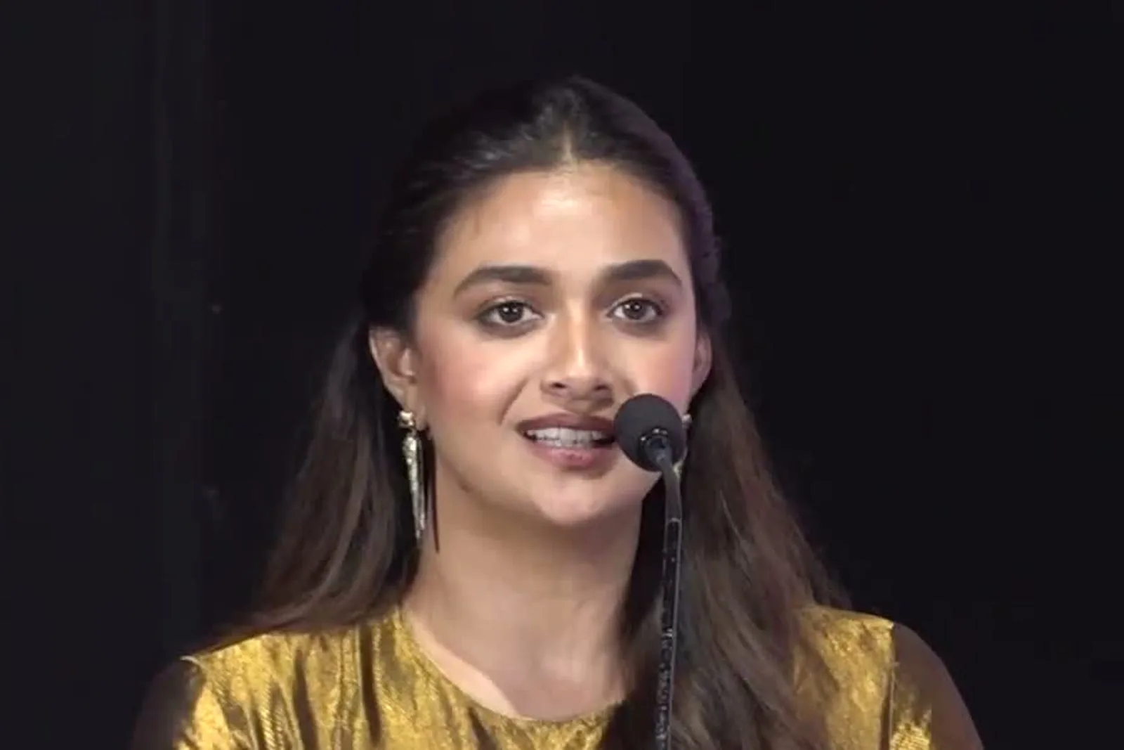 Keerthy Suresh — At the podium, talking about Dorothy