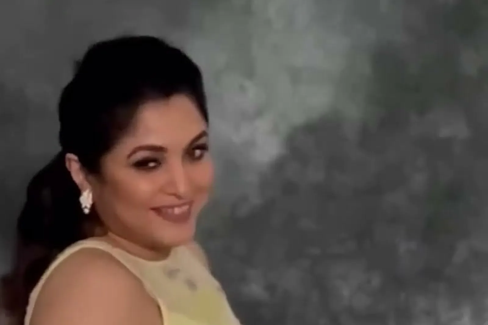 Ramya Krishnan — Mid-swirl in front of the grey painted backdrop