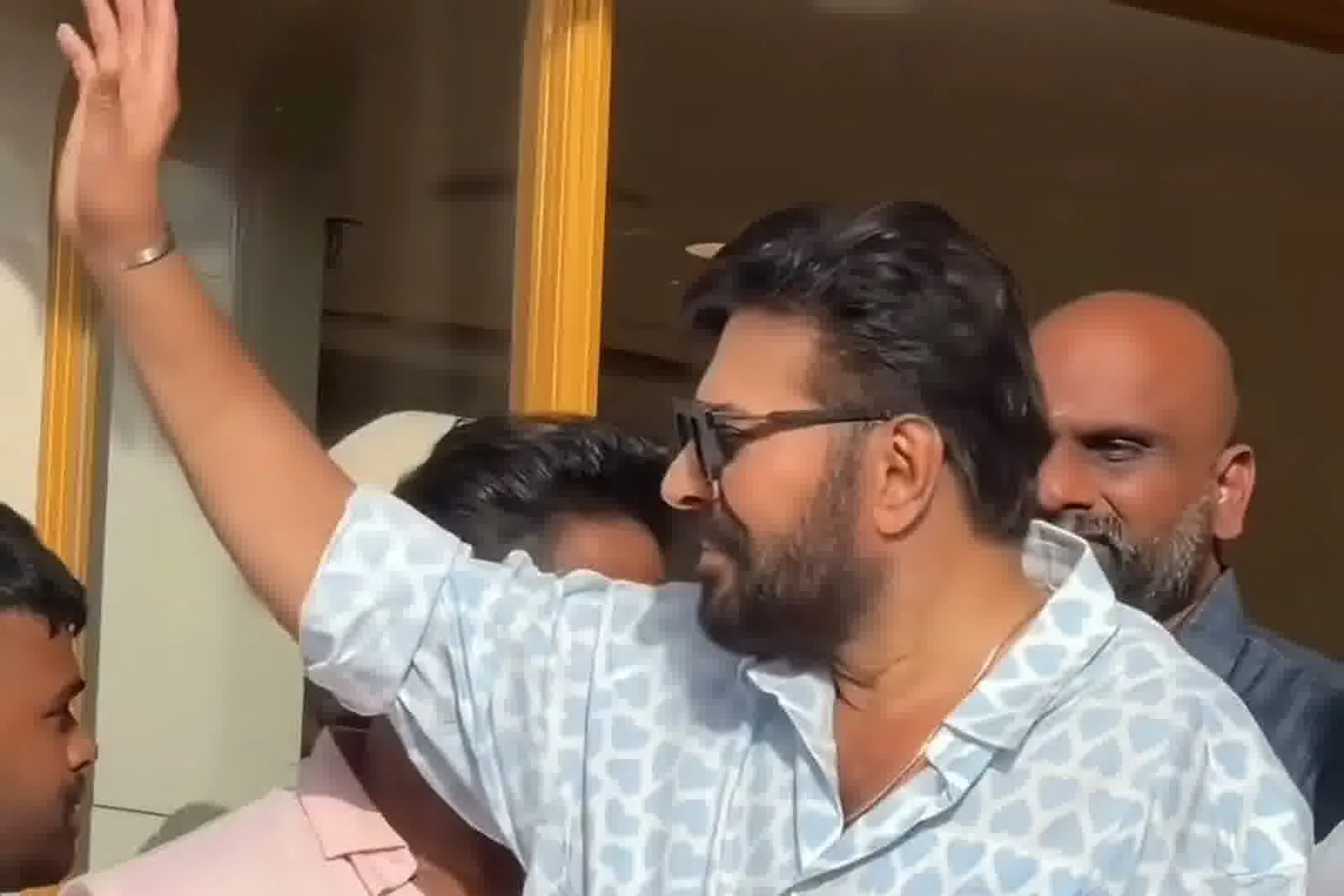 Mammootty — Side on, mid-wave: the sleeve roll sitting just below the elbow