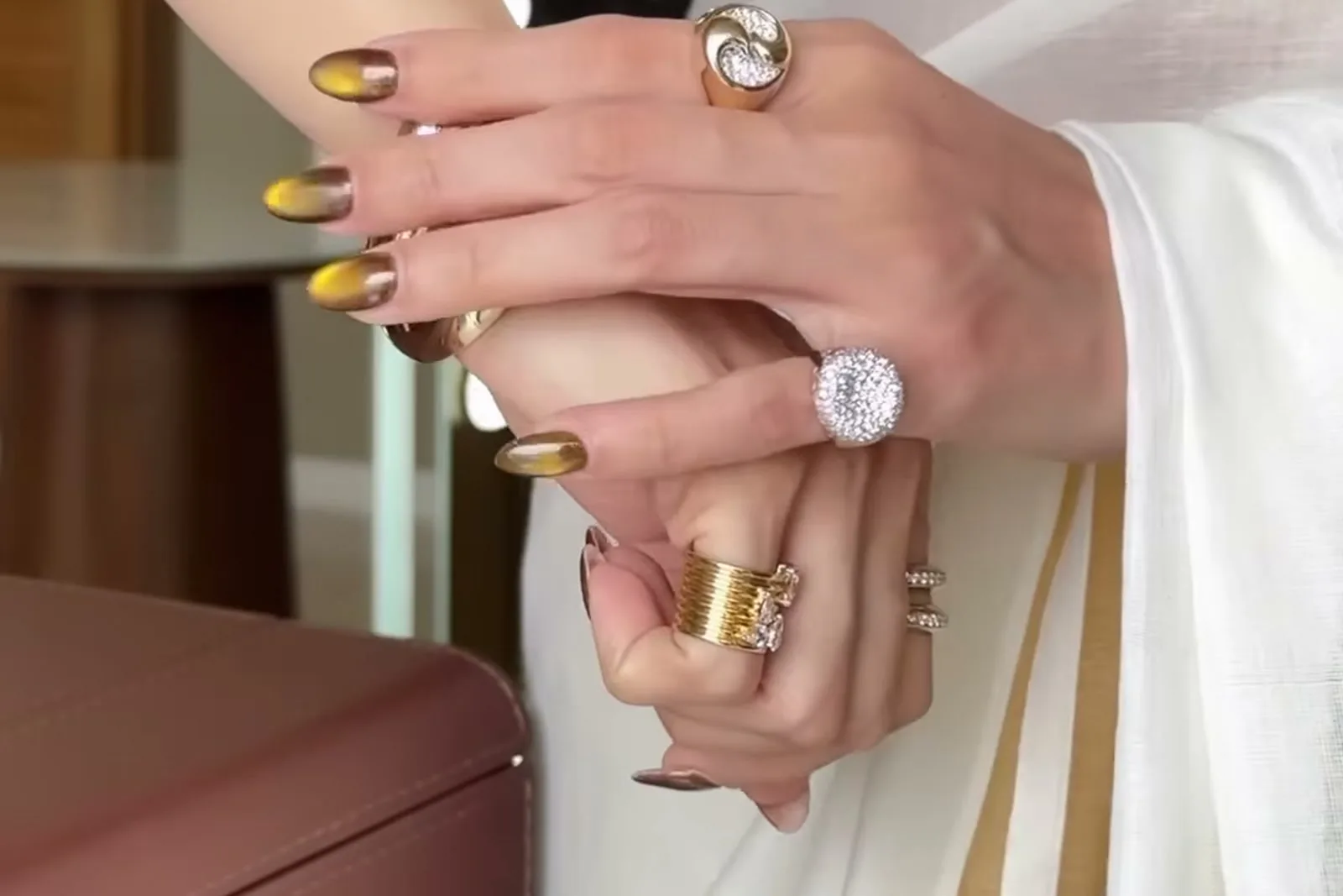 Tamannaah Bhatia — Both hands — the pavé dome, the ribbed bands, and the two bangles above them