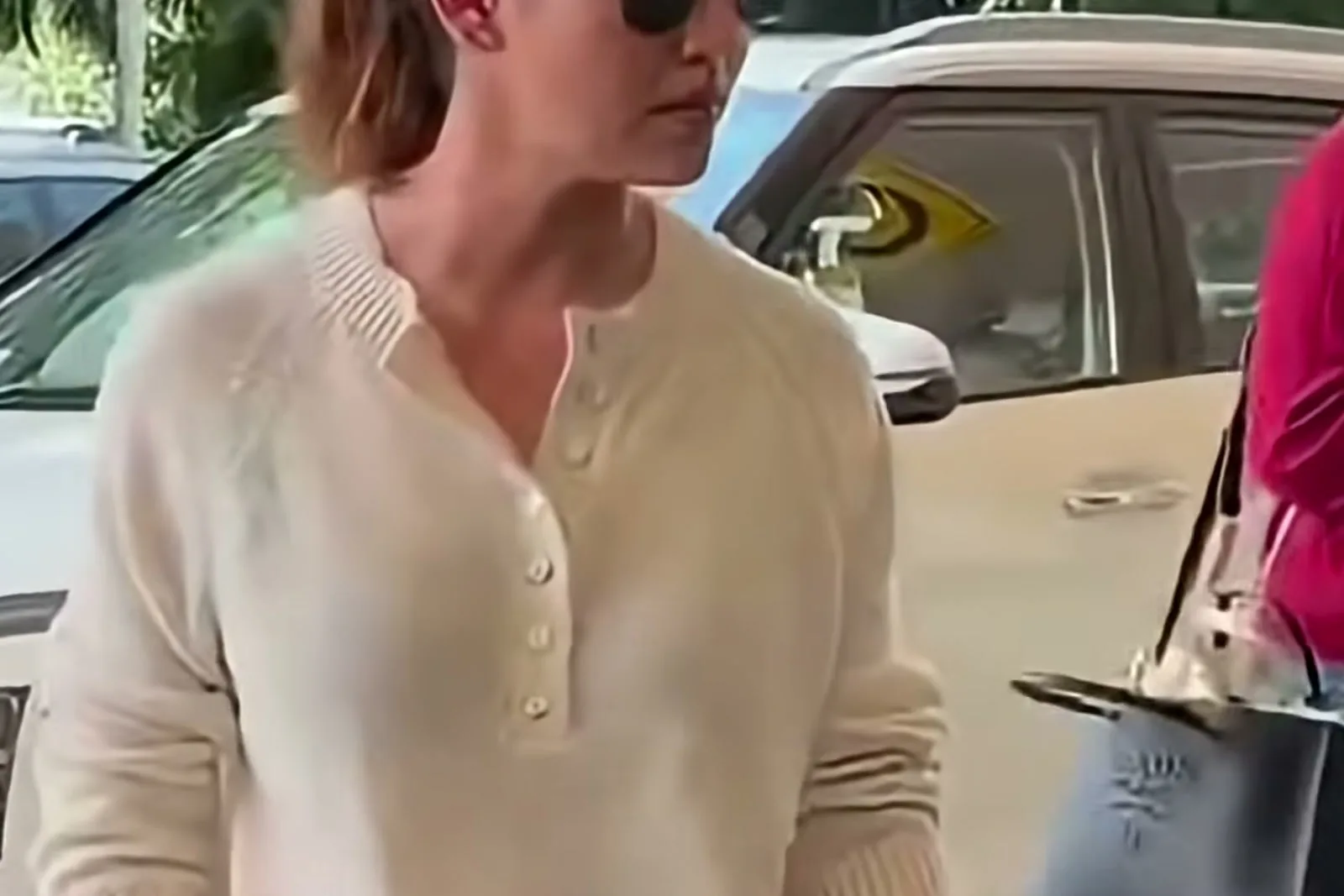 Nayanthara — The placket at its full depth, and the fine flat gauge of the knit