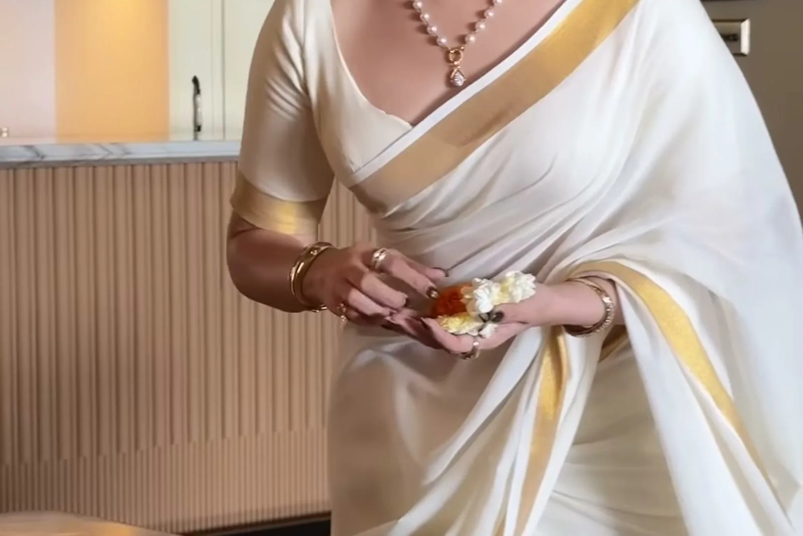 Tamannaah Bhatia — Laying the sadhya: how the drape sits when she is actually doing something in it