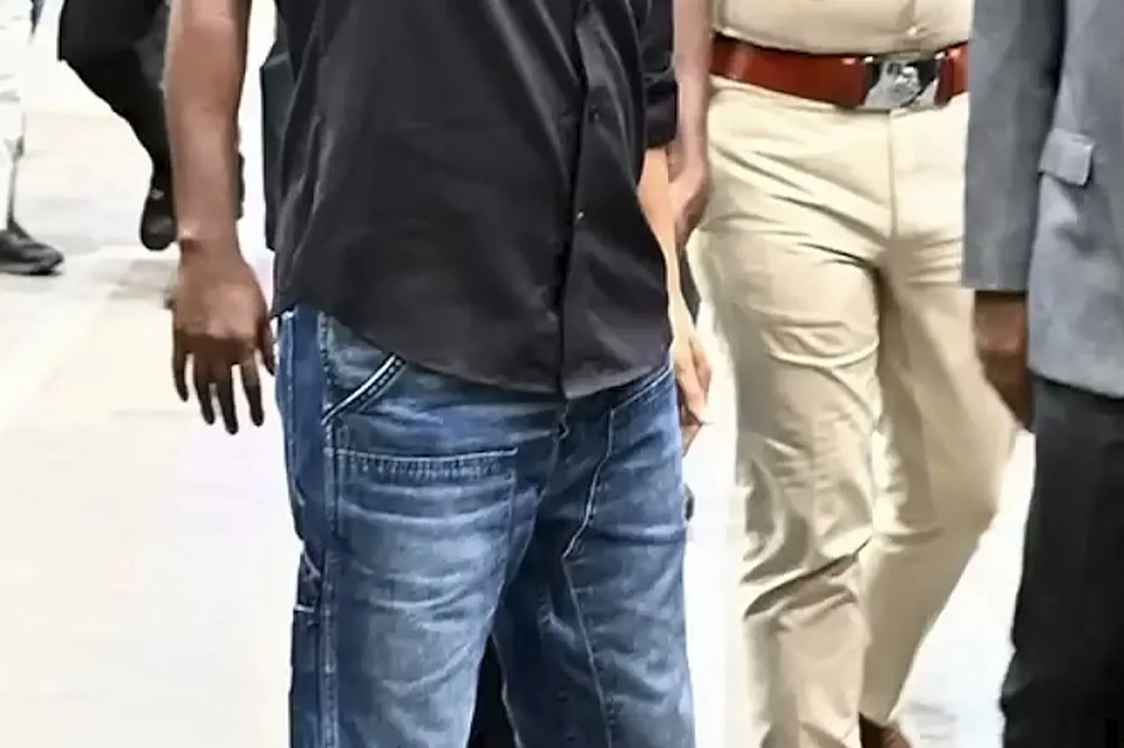 Vijay — The waist down: untucked hem, five-pocket front, straight leg
