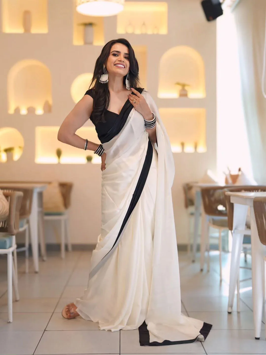 ARPITA FASHION Ivory crepe saree with a black border