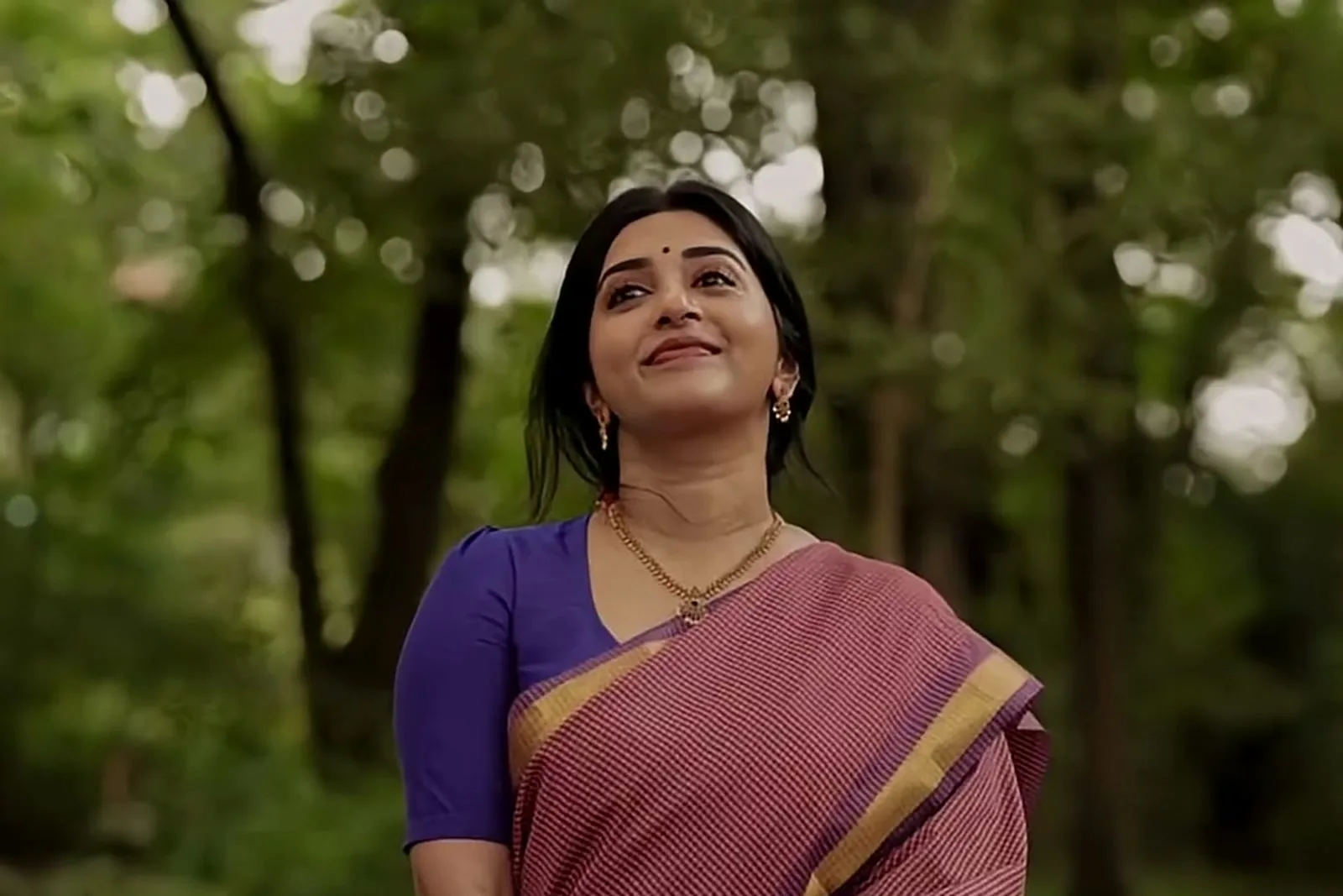 Meera Jasmine — In the forest, looking up