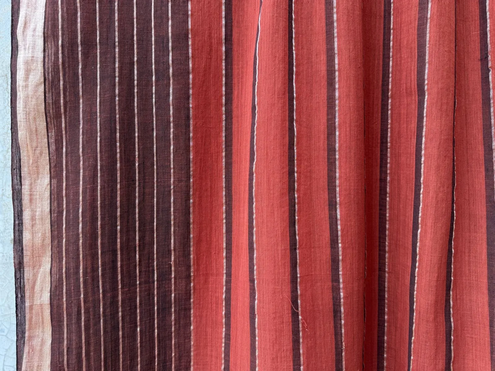 Taanbaan Rust saree with indigo stripe band and gold-striped border