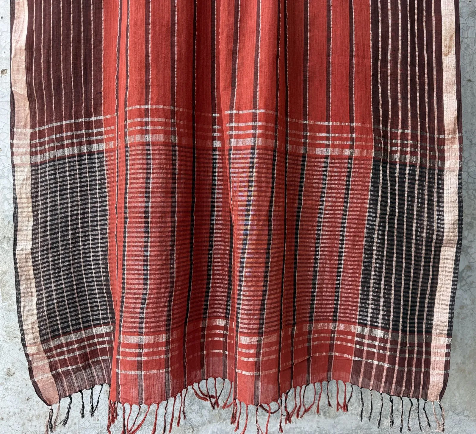 Taanbaan Rust saree with indigo stripe band and gold-striped border